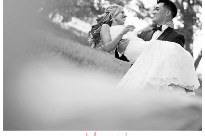 Frame20 Groom carrying bride at their wedding at Arrowhead Golf Club