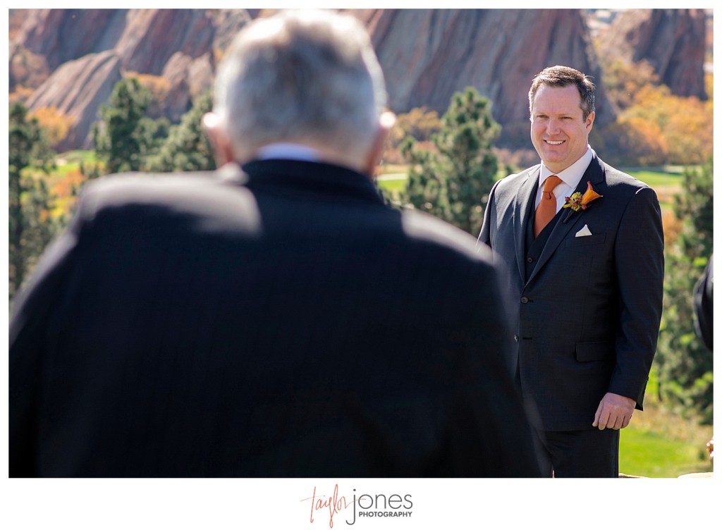 Groom at the alter Arrowhead Golf Course wedding ceremony in the fall