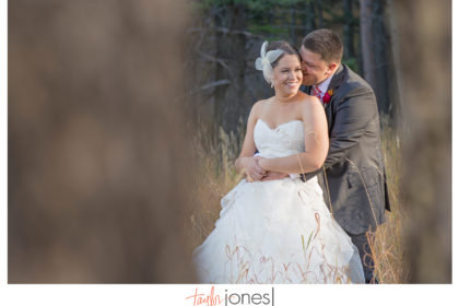 Kilbourne32 Bride and groom in trees at Pines at Genesee wedding