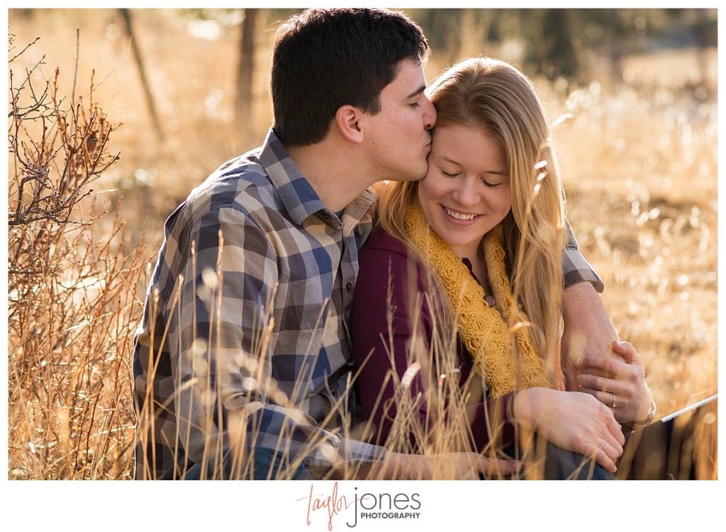 Couple kissing at engagement shoot in Evergreen Colorado