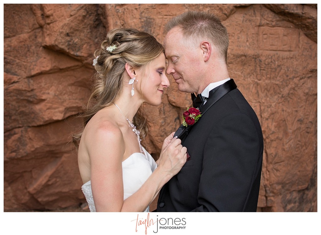 Bride and groom portraits at Perry Park wedding with red rocks
