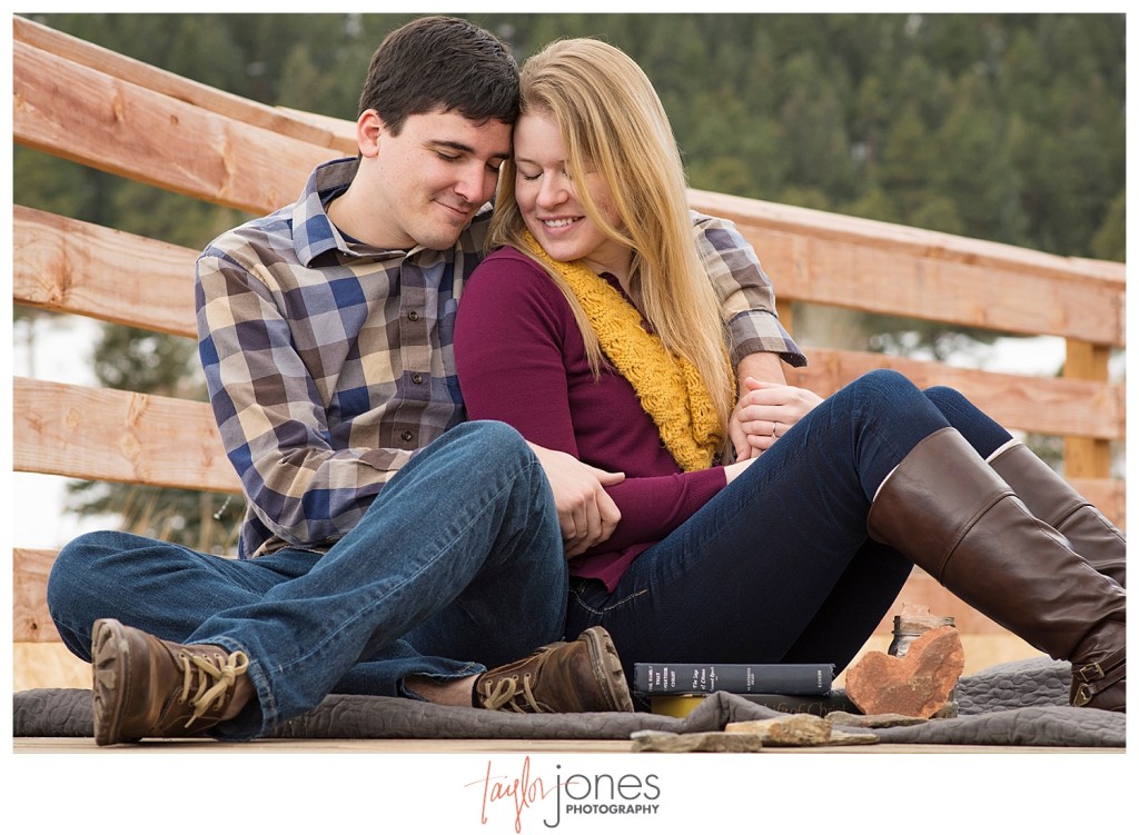 Couple sitting on a dock in Evergreen