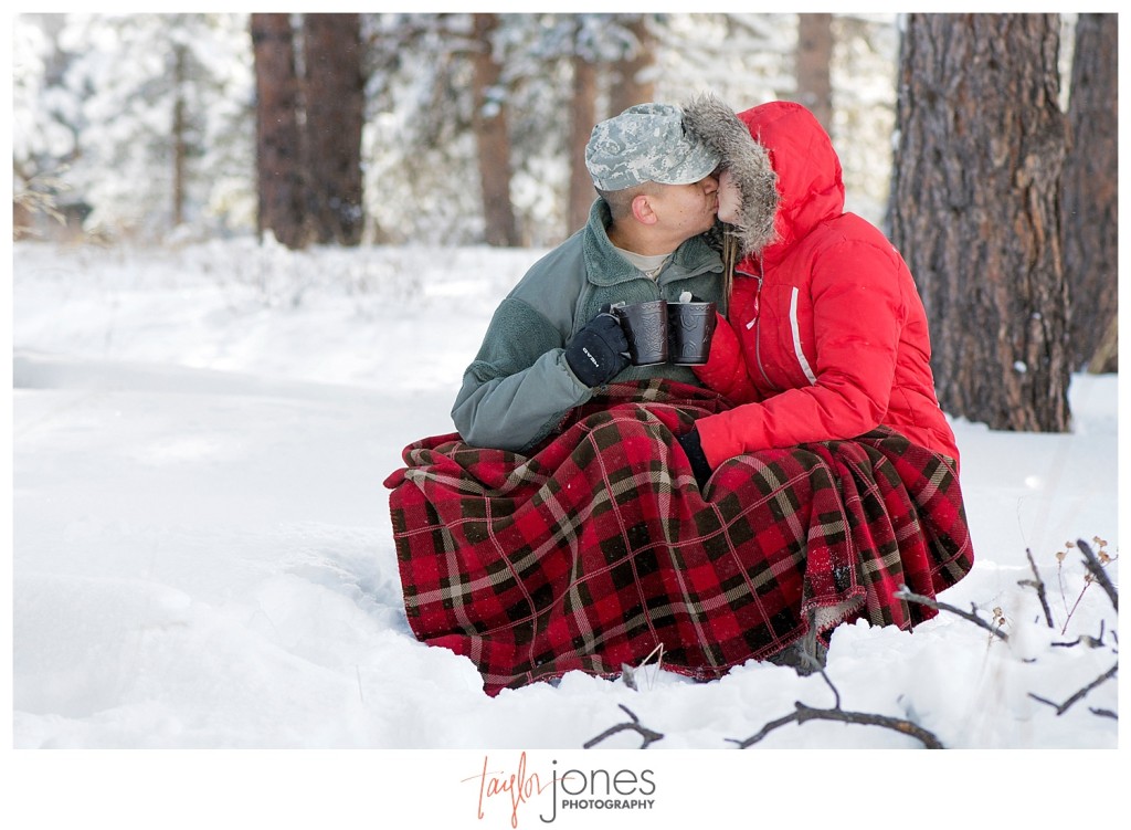 Army couple drinking hot cocoa in the winter at Mt. Falcon Morrison Colorado