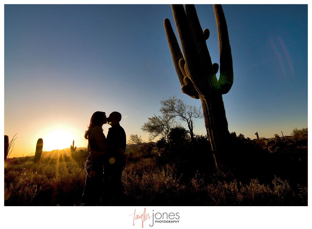 Couple kissing at sunset at Superstition Mountains in Phoenix, Arizona engagement shoot