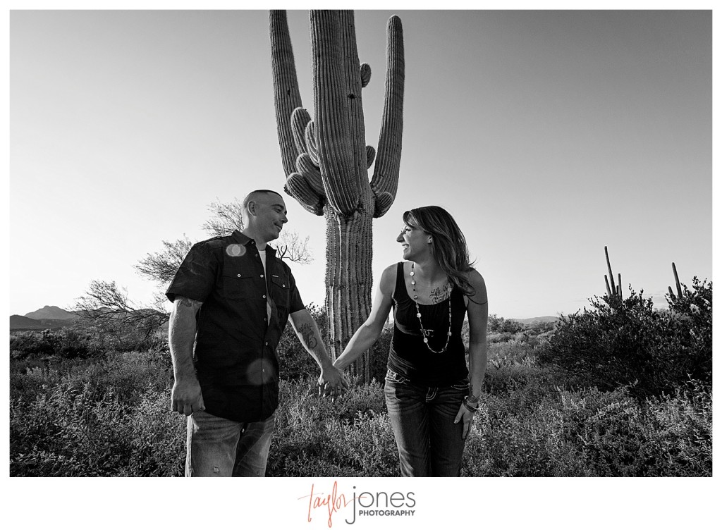 Black and white of couple with cactus in Arizona