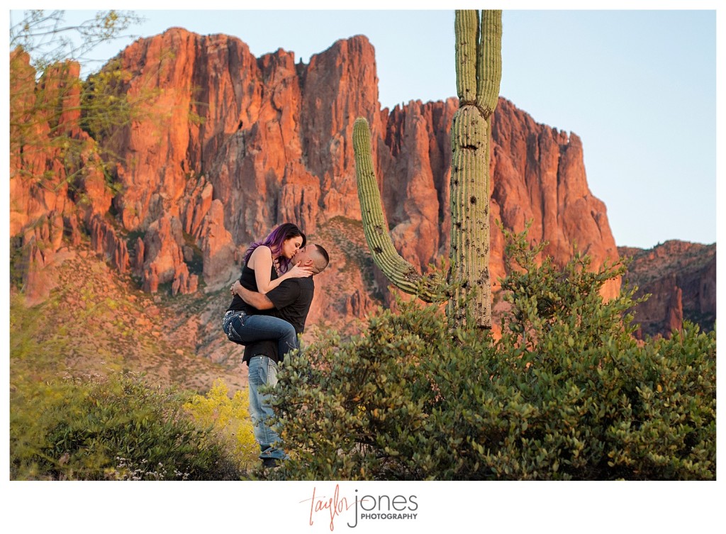 Couple kissing at engagement shoot, the Superstition Mountains