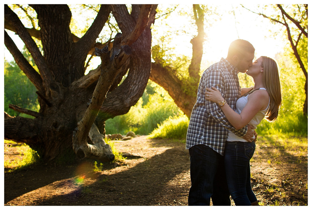 Colorado engagement shoot at Lair O the Bear couple dancing in sunlight and trees