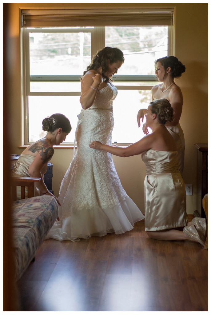 Bride putting on dress and getting ready for wedding at Mt. Vernon Country Club in Golden, Colorado