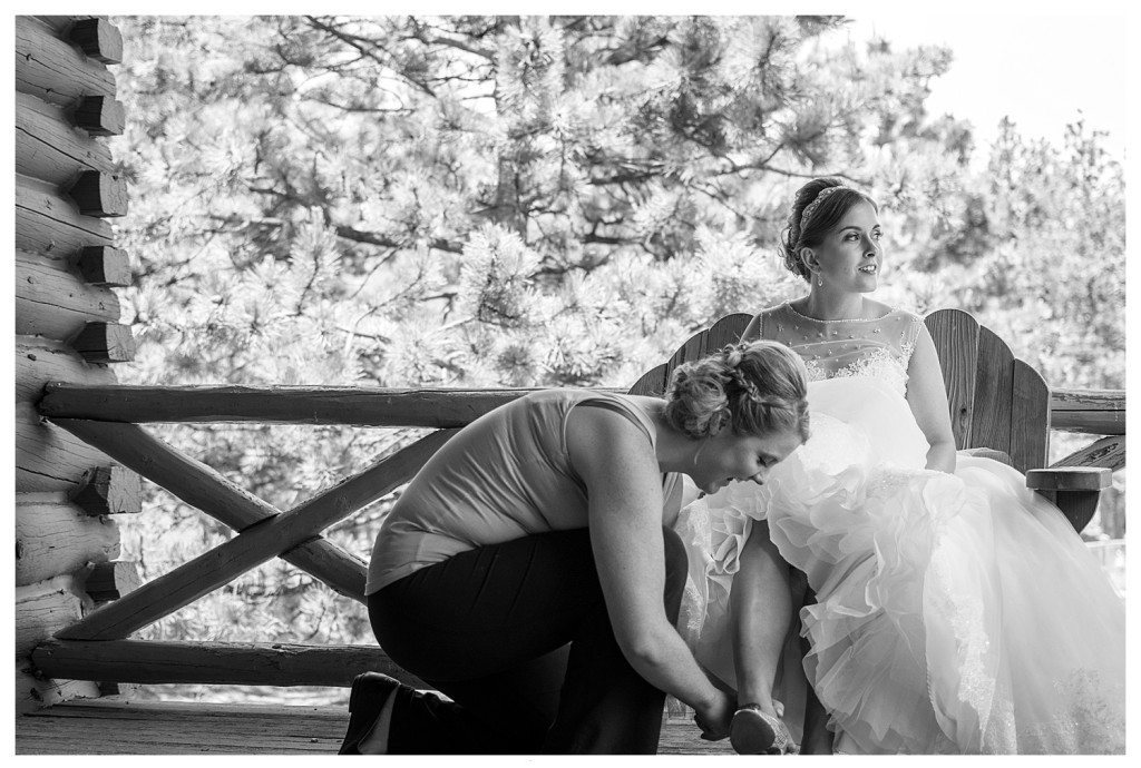Bride getting dressed at YMCA of the Rockies in Estes Park, Colorado