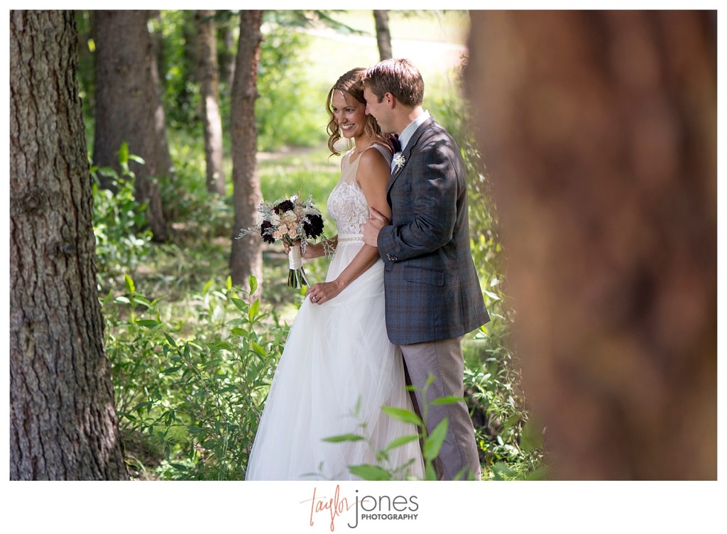 Black Canyon Inn Estes Park wedding first look with bride and groom portraits