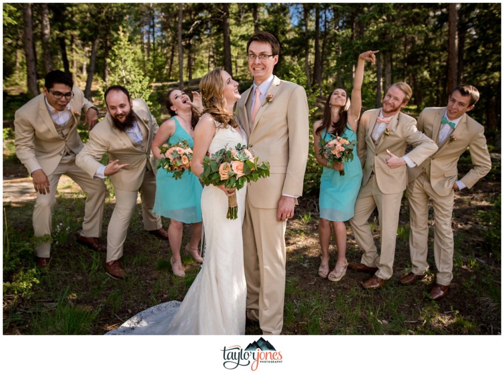 Evergreen Red Barn wedding ceremony with bridal party