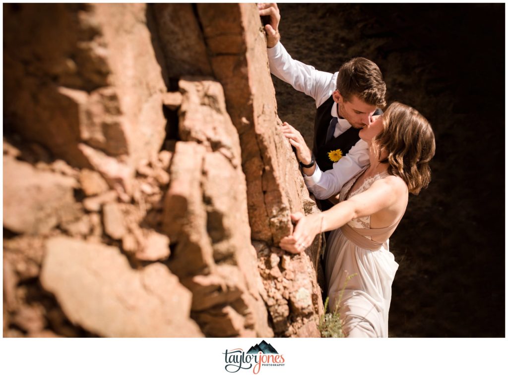 Eden West Ranch Wedding bride and groom climbing portraits