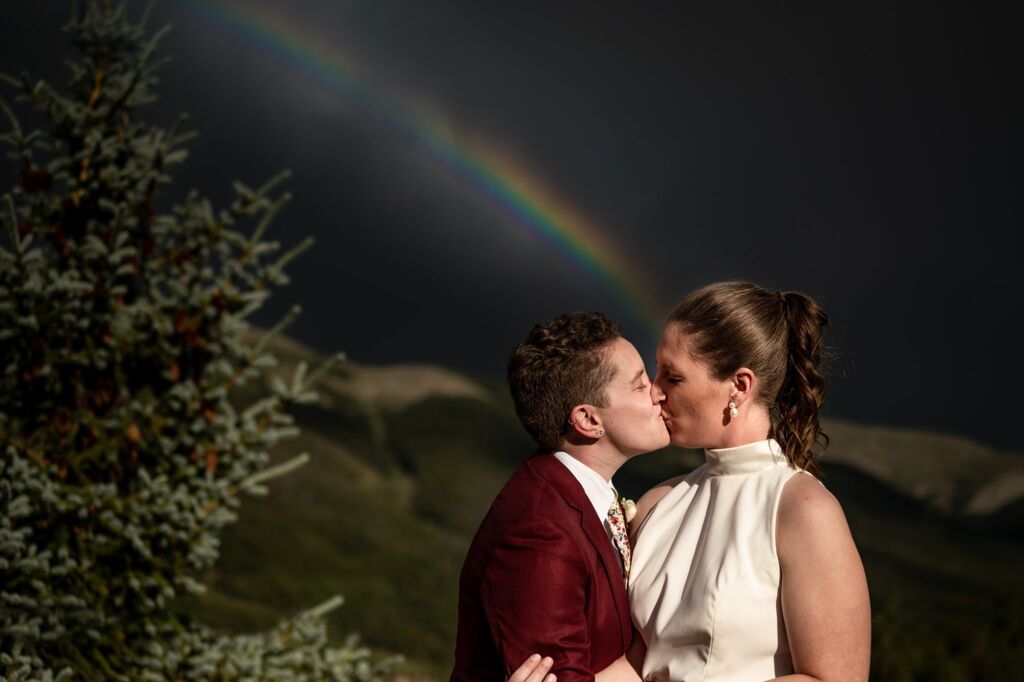 Copper Mountain wedding photographer with brides under a rainbow