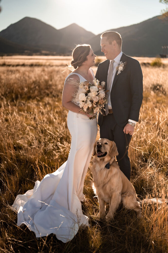 Bride and groom with their dog at the Barn at Sunset ranch wedding venue in Buena Vista, Colorado
